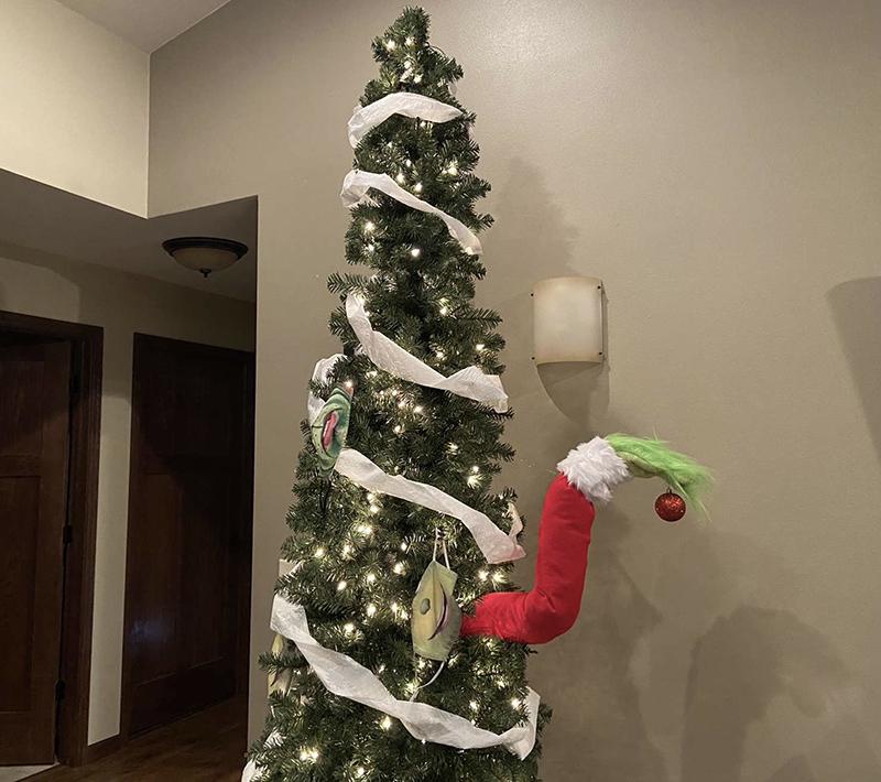Christmas tree with grinch arm