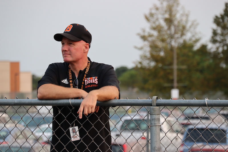 Athletic Director Jay Weinman watches over a September 15 soccer game at Tiger Field. Photo by Mia Handly.