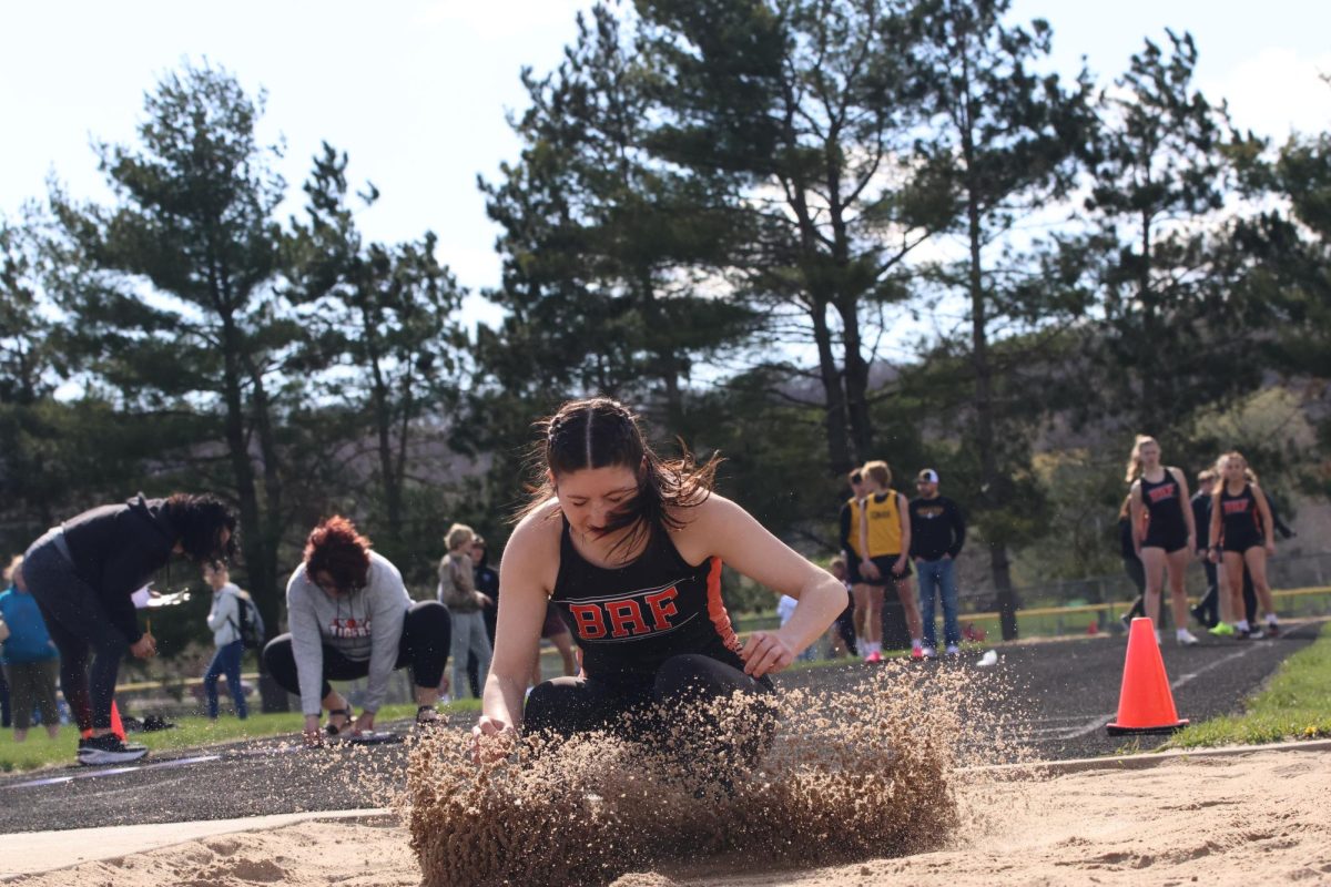 Junior Ava Batista doing her second practice for the long jump