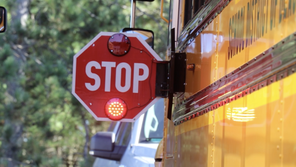 Stop sign activated on bus.